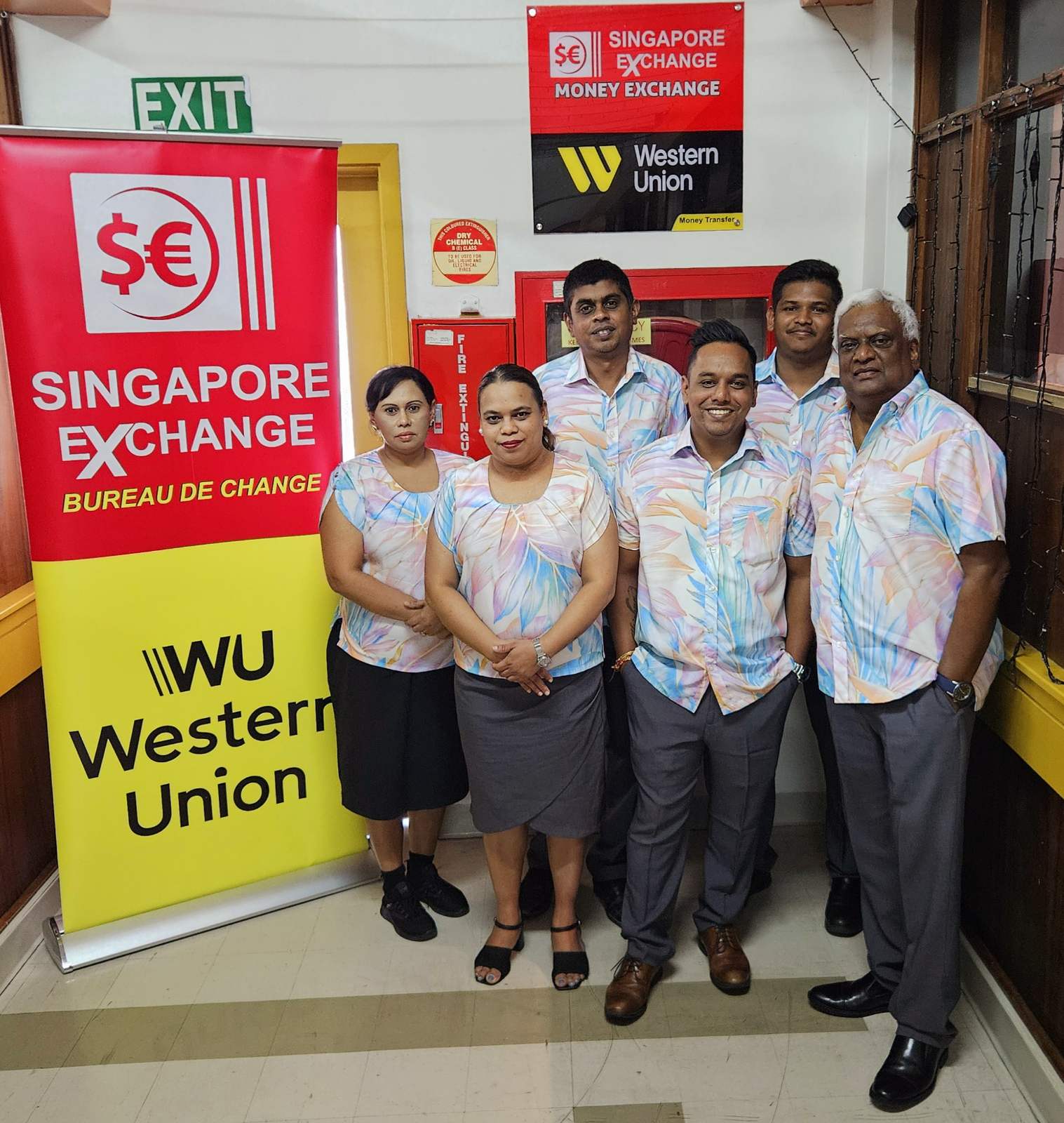 Singapore Exchange & Western Union team in pastel print shirts