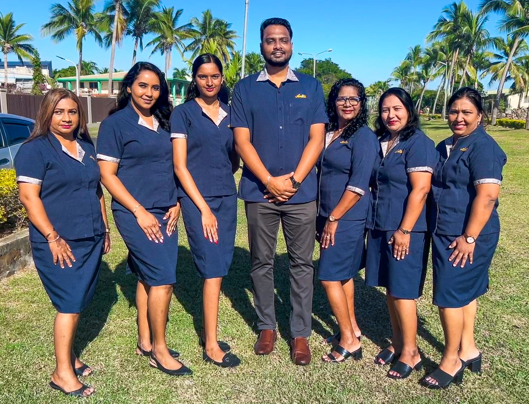 Anita Jewellers team portrait among palm trees