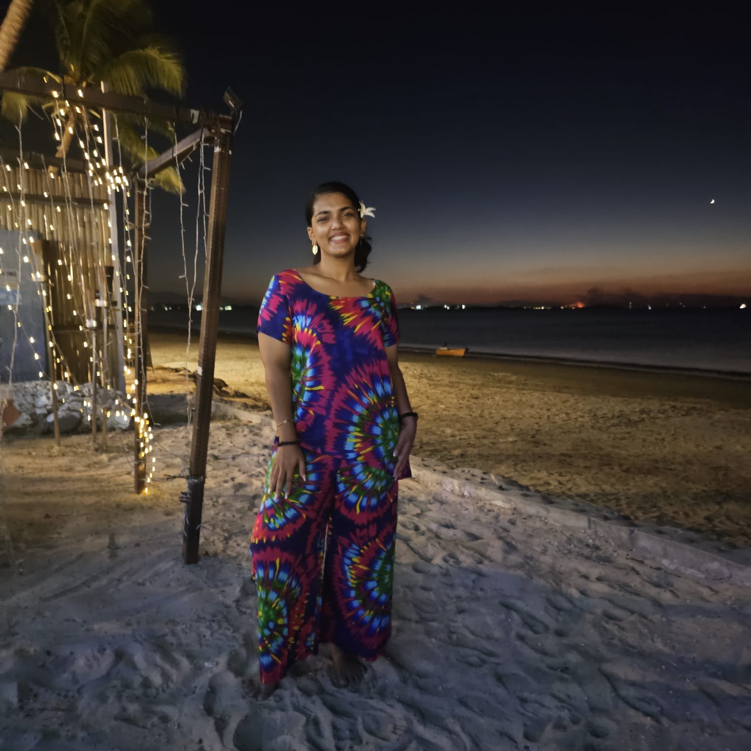 Tie-dye resort leisure dress on Fijian beach at twilight